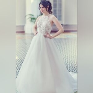 Halter Style Open Back Ball Gown With Heavily Embellished Bodice